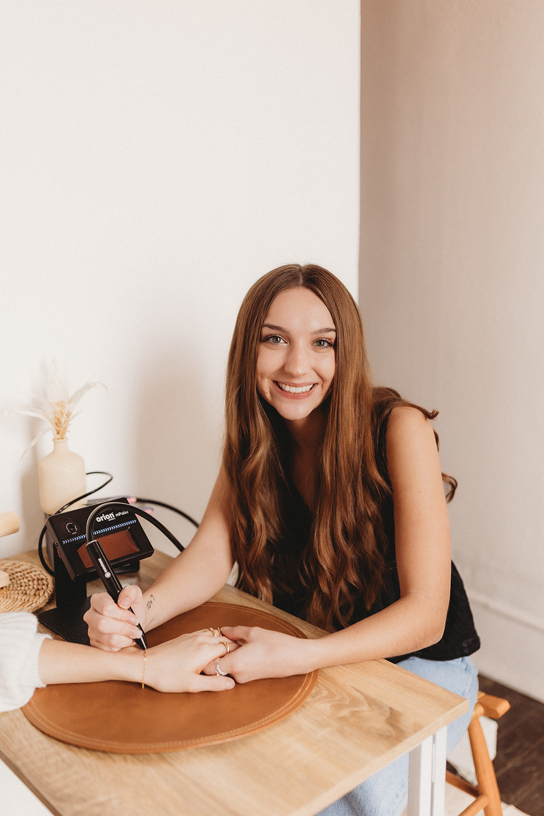 Women smiling, long curly brown hair, Jewelry, Permanent Jewelry appointments 